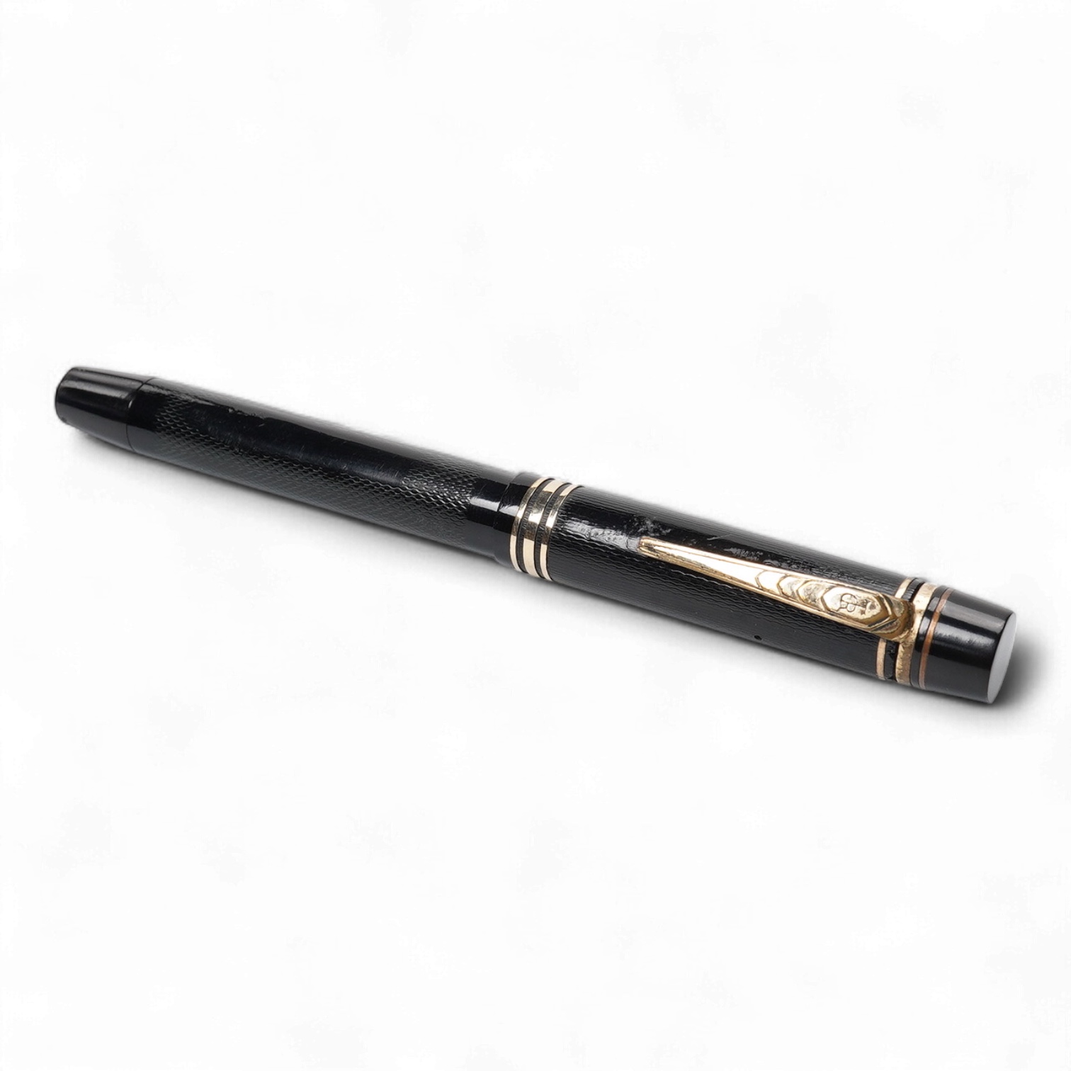 A De la Rue Onoto piston fill fountain pen in large size with ornate cap banding and fitted with DLR Onoto No.5 14ct. nib
